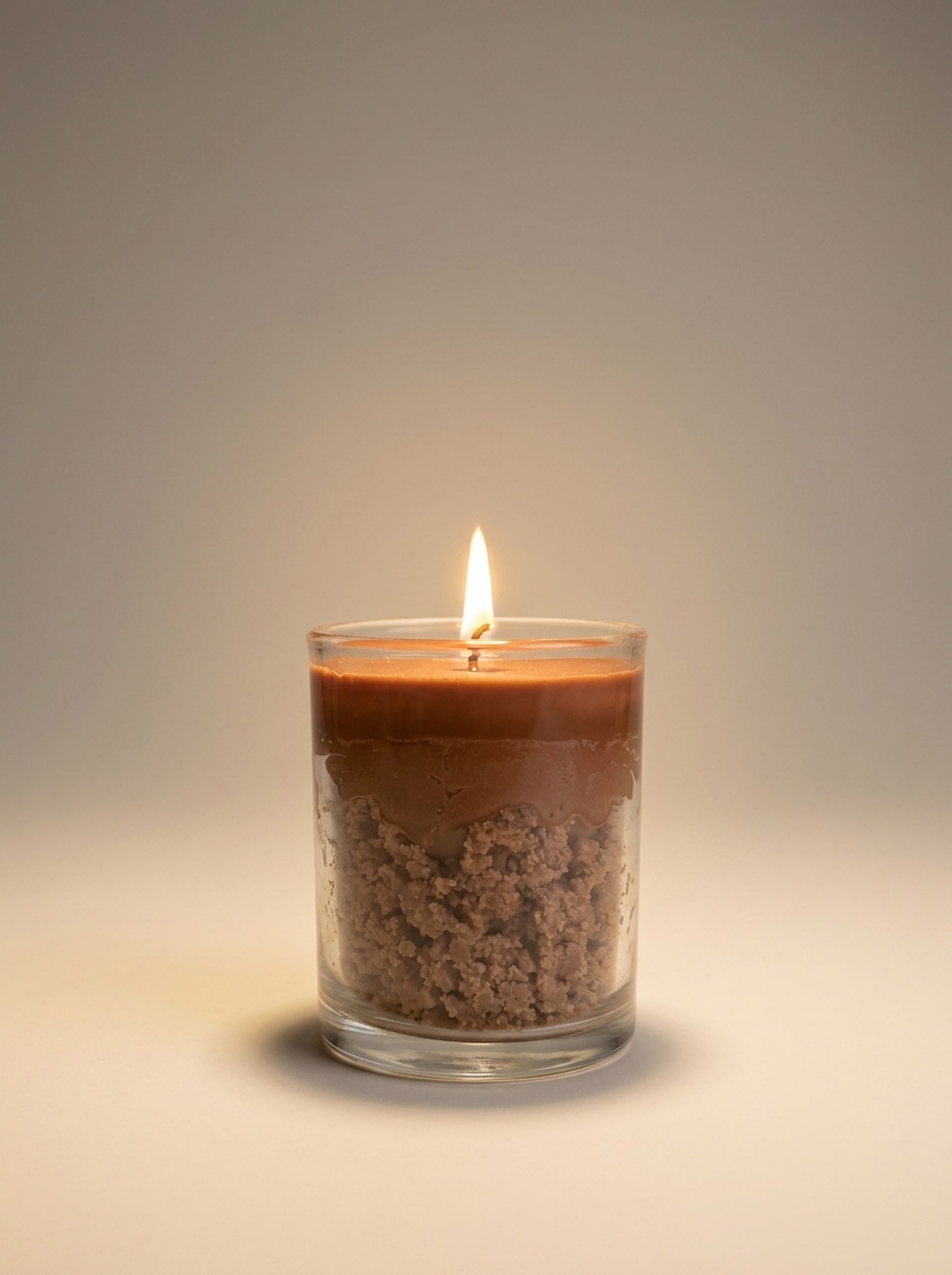 LUMEA SENSES chocolate dessert soy candle on a neutral studio background